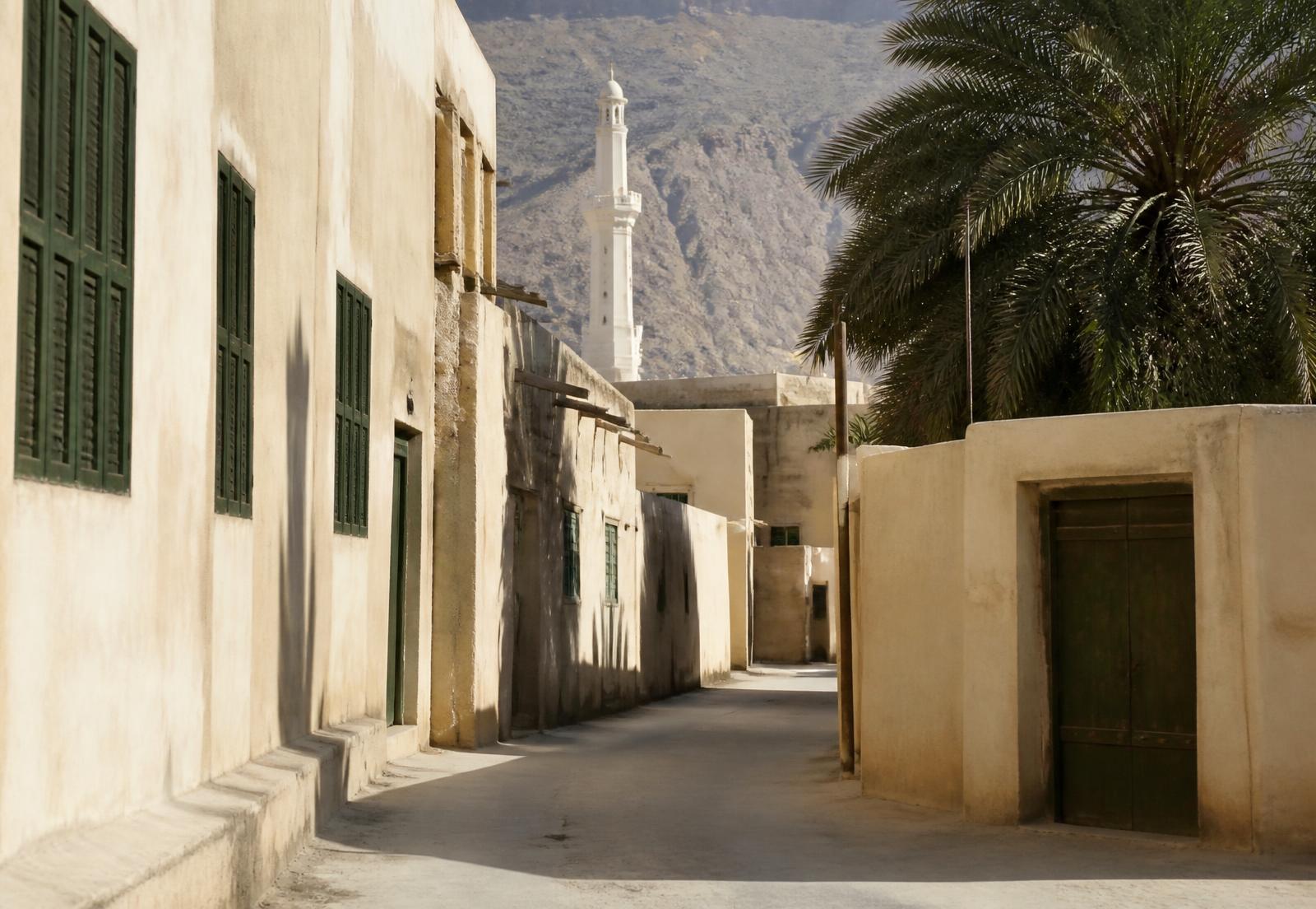 Tarim skyline with minarets, palms and mountains